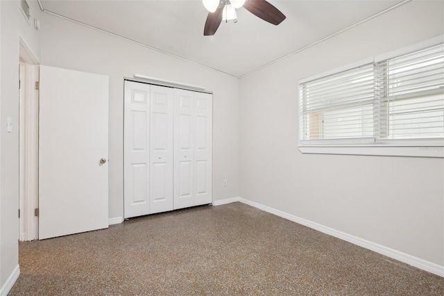4221 Mizell St, Orlando, FL 32812 - unfurnished bedroom featuring baseboards, ceiling fan, a closet, and speckled floor