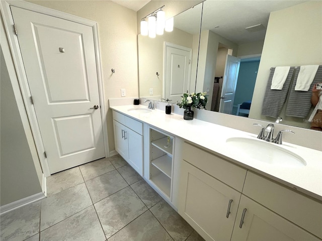 bathroom with vanity and tile patterned flooring