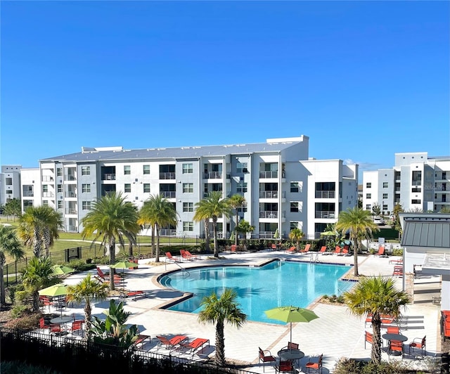 view of swimming pool featuring a patio area