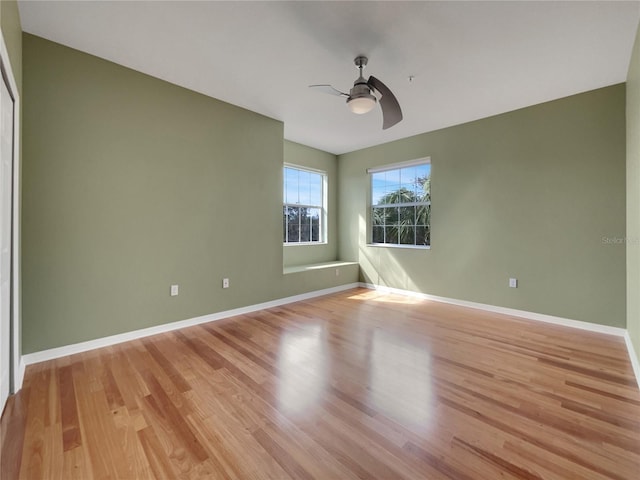 spare room featuring ceiling fan and light hardwood / wood-style flooring