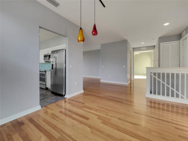 empty room with hardwood / wood-style flooring