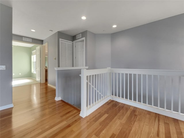 corridor featuring light hardwood / wood-style flooring