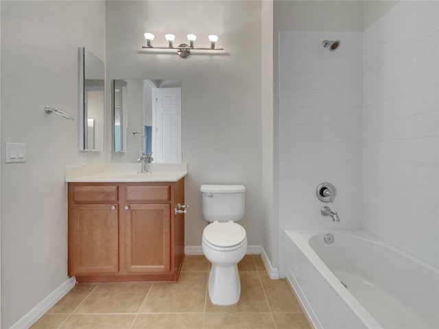 full bathroom with tiled shower / bath, vanity, toilet, and tile patterned floors