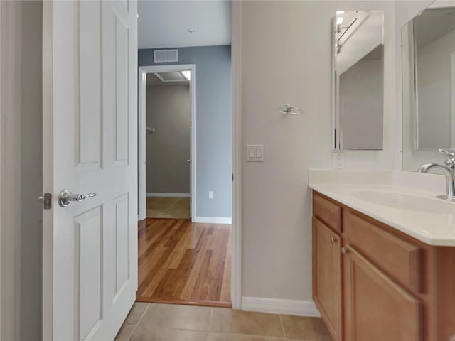 bathroom with vanity and hardwood / wood-style floors