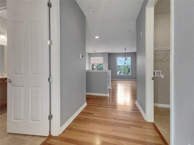 hallway with light wood-type flooring