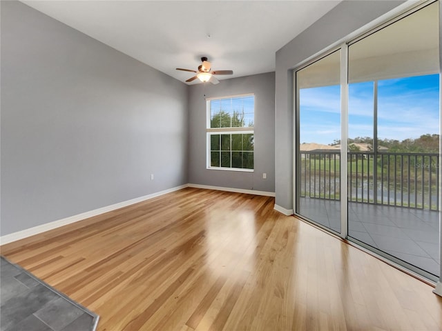 spare room featuring hardwood / wood-style flooring and ceiling fan