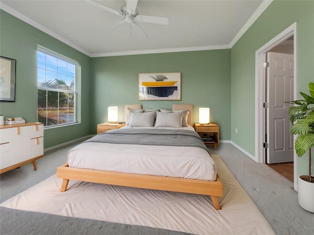 bedroom with crown molding, carpet, and ceiling fan