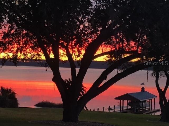 nature at dusk featuring a water view