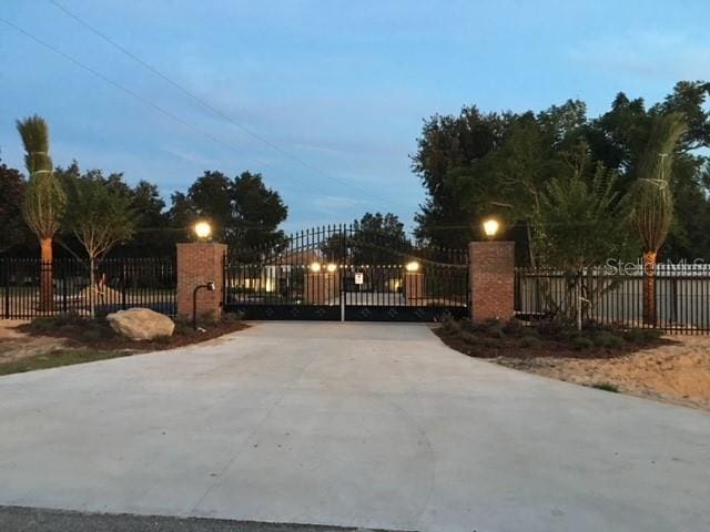 view of gate at dusk