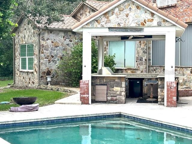 view of swimming pool featuring a patio area