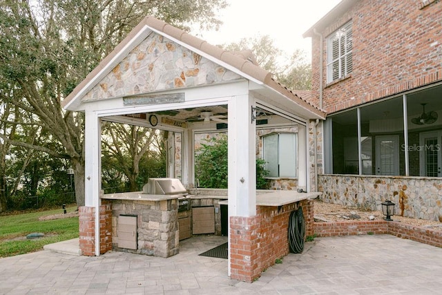 view of patio with a gazebo, grilling area, and an outdoor kitchen