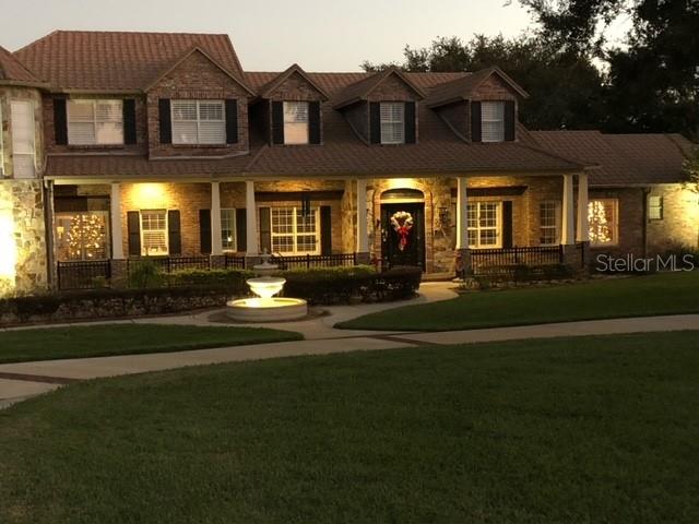 view of front of home with a yard