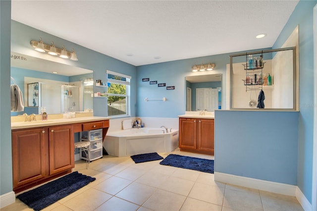 bathroom with vanity, a textured ceiling, tile patterned flooring, and plus walk in shower