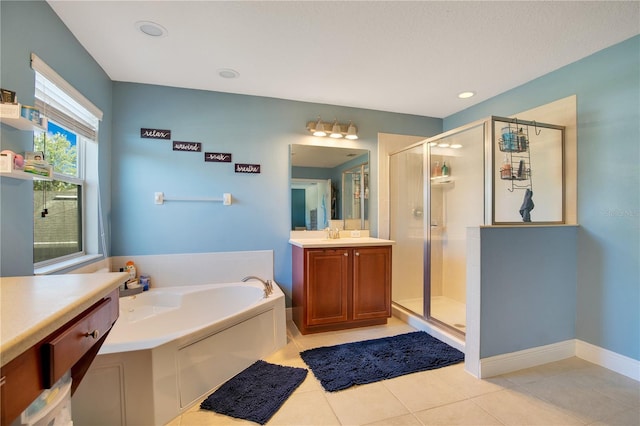 bathroom featuring vanity, shower with separate bathtub, and tile patterned flooring