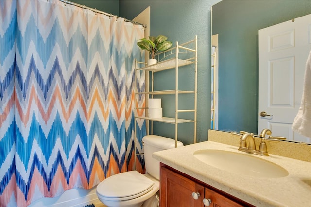 full bathroom featuring toilet, vanity, and shower / bath combination with curtain