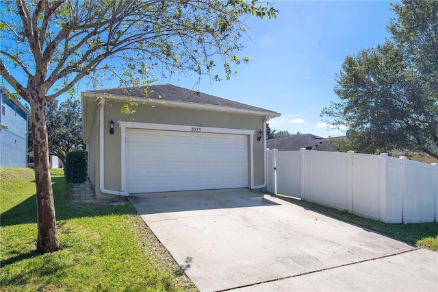 2053 Nobscot Pl, Apopka, FL 32703 - garage featuring concrete driveway and fence