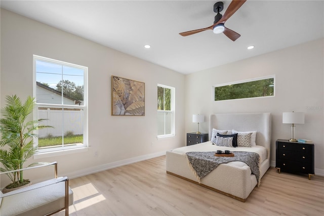 bedroom with a ceiling fan, light wood-style flooring, recessed lighting, and baseboards