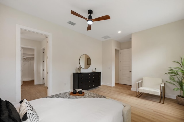 bedroom with visible vents, wood finished floors, recessed lighting, baseboards, and ceiling fan