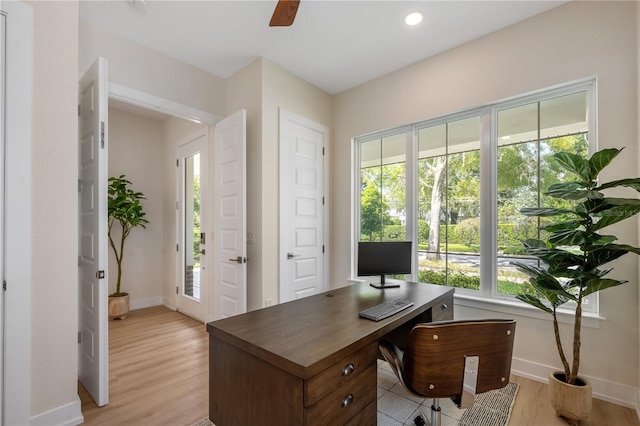 office area featuring recessed lighting, baseboards, a ceiling fan, and light wood finished floors