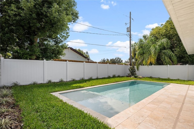 view of swimming pool with a lawn, a patio, a fenced backyard, and a fenced in pool