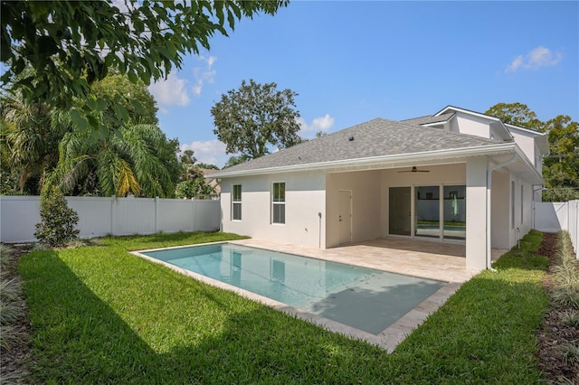 back of property with a lawn, stucco siding, a fenced backyard, a patio area, and a ceiling fan