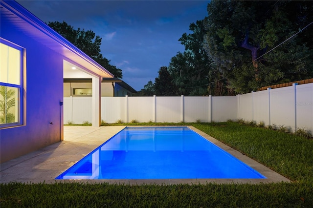 view of swimming pool with a fenced in pool, a fenced backyard, and a patio area