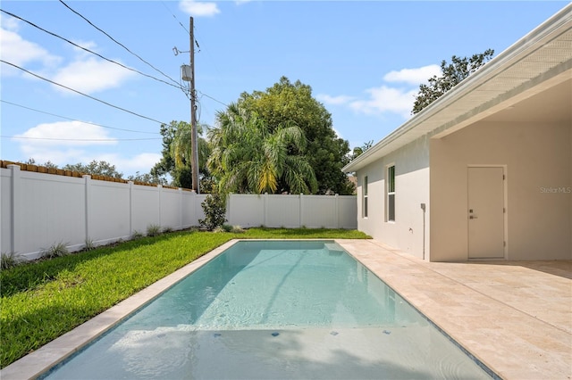 view of swimming pool featuring a fenced in pool, a fenced backyard, and a patio area