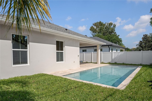 view of swimming pool with a fenced in pool, a patio, a yard, and fence