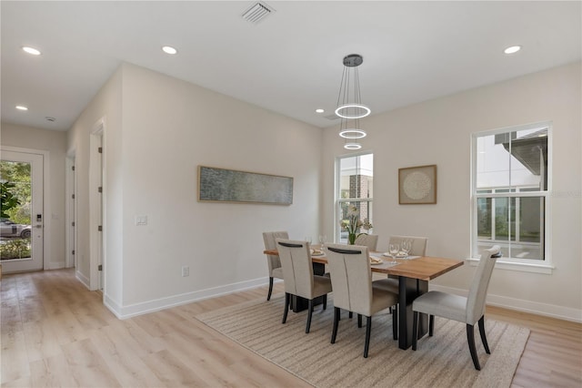 dining space with visible vents, recessed lighting, light wood-type flooring, and baseboards