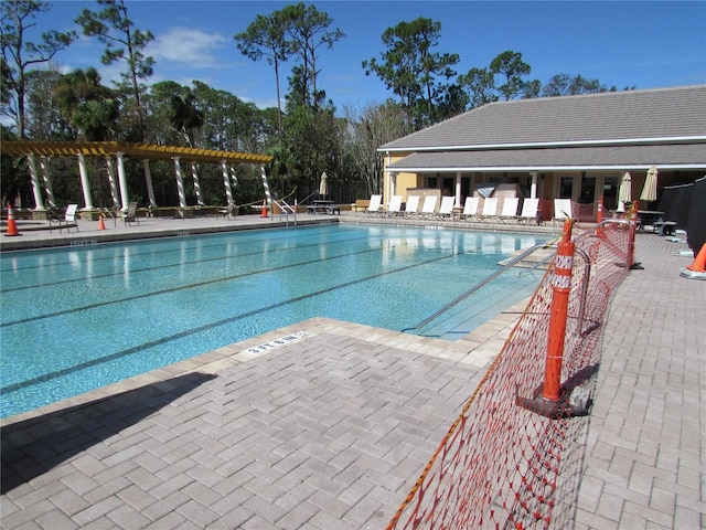 view of swimming pool featuring a patio area