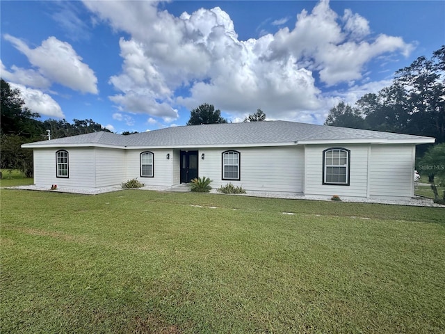 ranch-style home with a front lawn