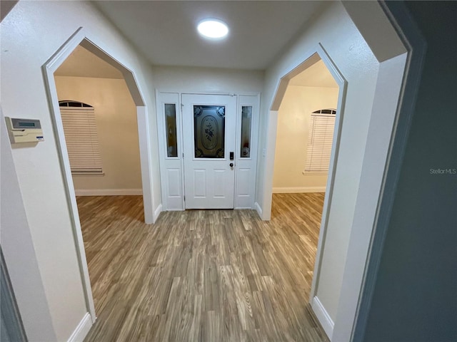 hall featuring wood-type flooring