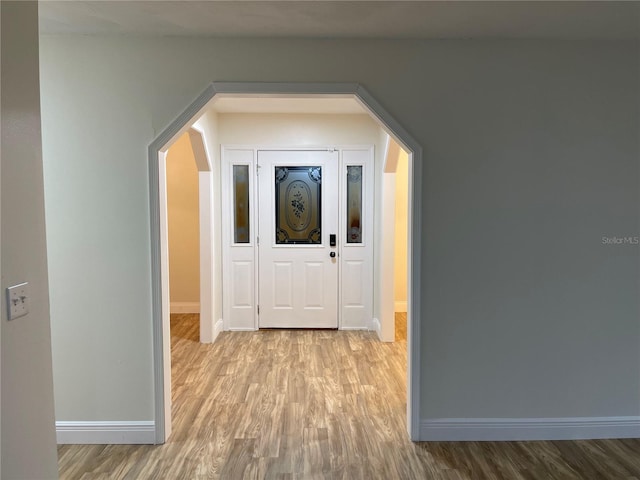 hallway with light wood-type flooring