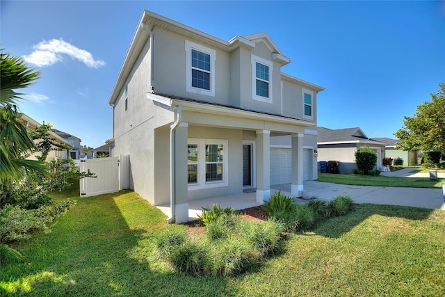 view of front of house with a garage and a front lawn