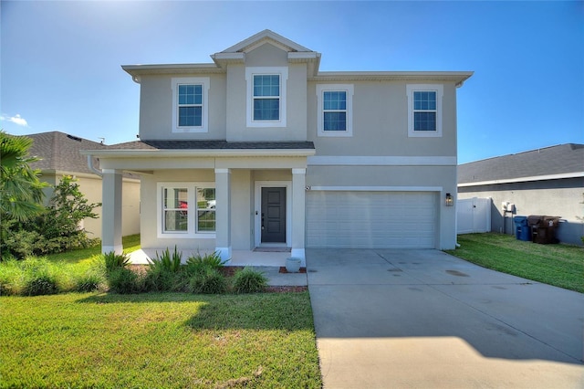 view of front property with a front lawn and a garage