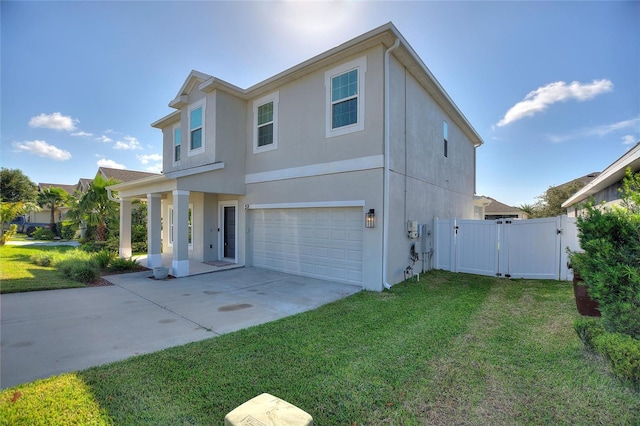 view of front of property with a front yard and a garage