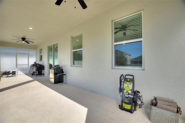 view of patio featuring ceiling fan