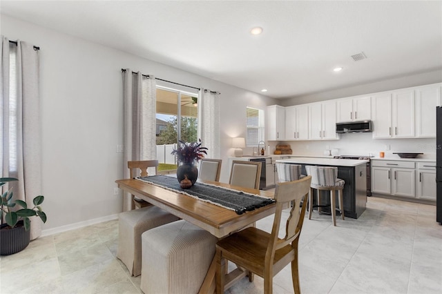 tiled dining space with sink