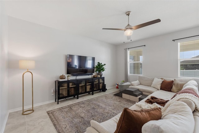 living room with a healthy amount of sunlight and ceiling fan