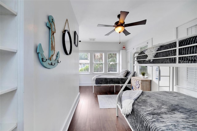 bedroom featuring ceiling fan and dark hardwood / wood-style floors