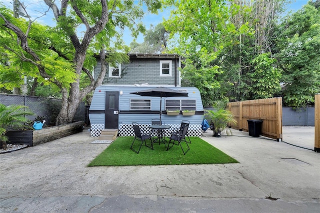 rear view of property featuring a patio area