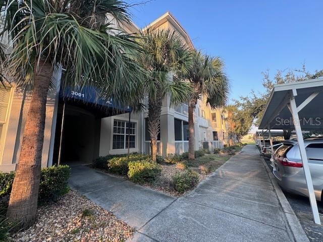 view of building exterior featuring a carport