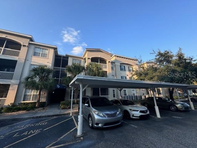 view of vehicle parking featuring a carport