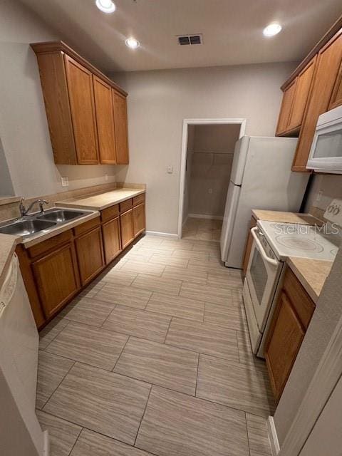 kitchen with white appliances and sink