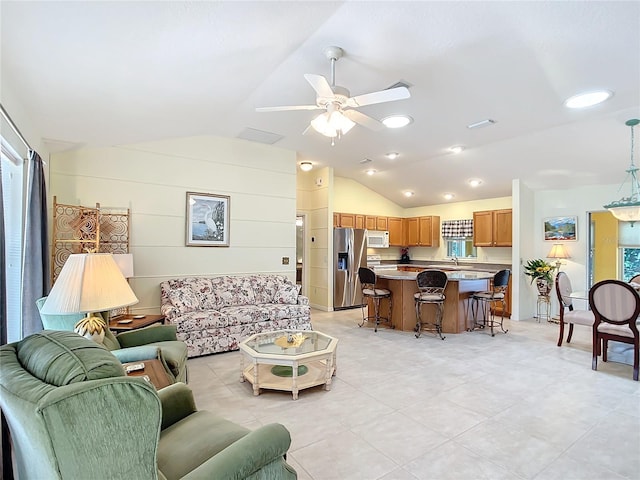 living room with lofted ceiling, sink, and ceiling fan