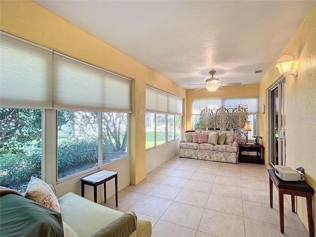 sunroom / solarium with ceiling fan