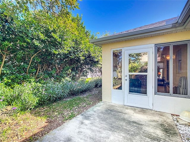 doorway to property featuring a patio area