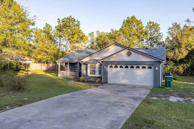 single story home featuring a garage and a front lawn