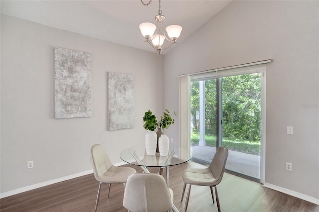 dining room featuring high vaulted ceiling, an inviting chandelier, and dark hardwood / wood-style floors