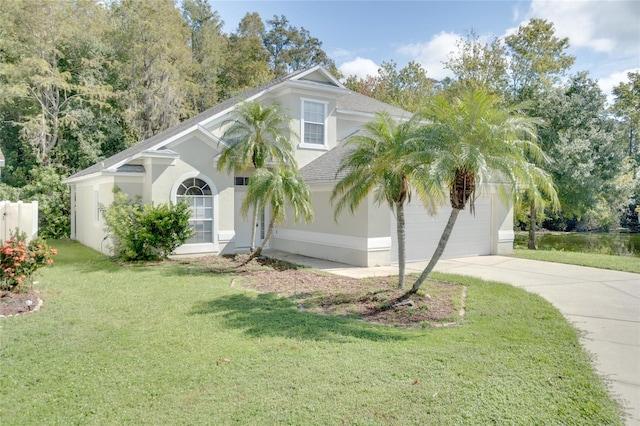 view of front facade with a front lawn and a garage